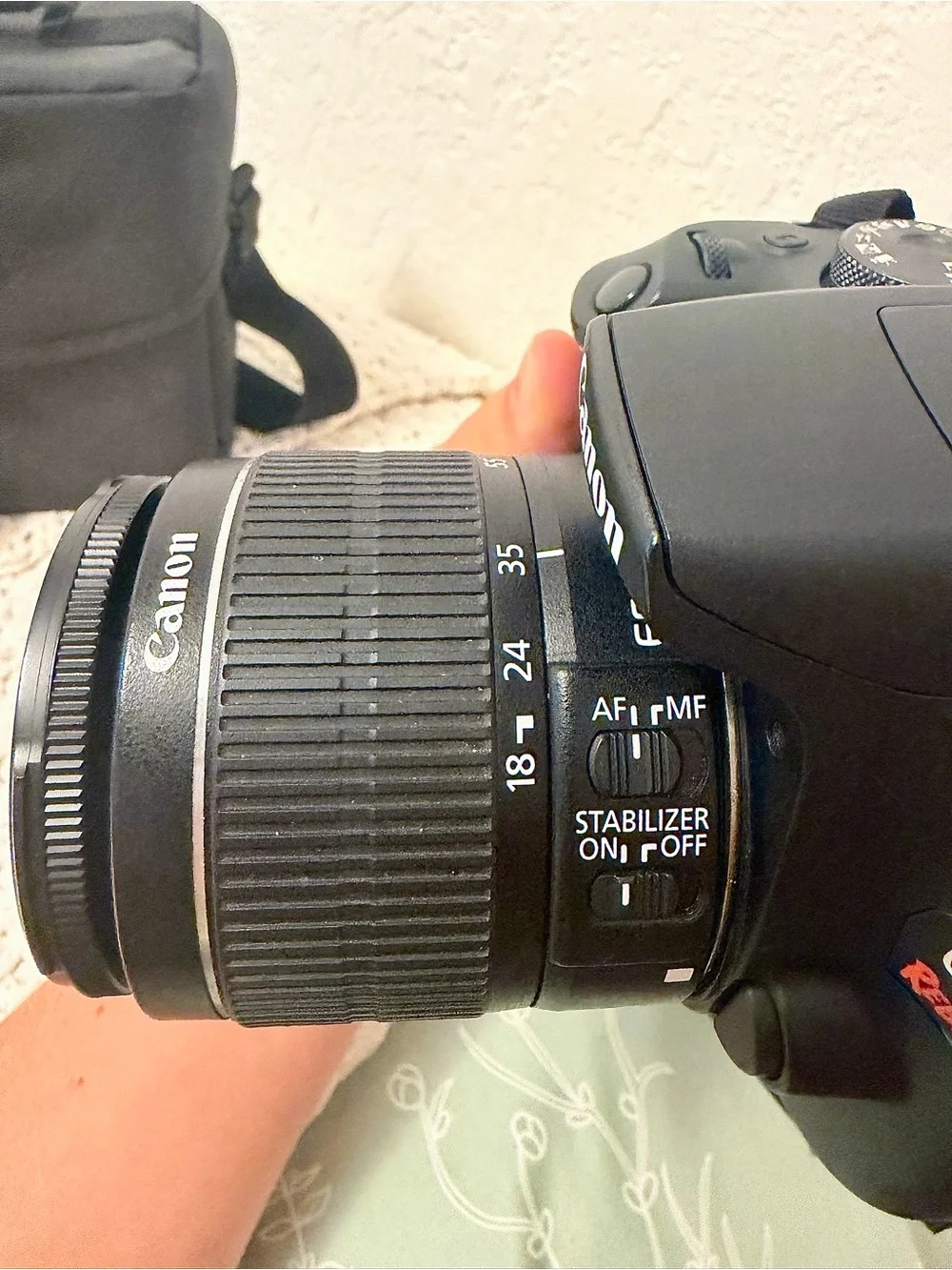 Canon DSLR Camera with Zoom Lens and Black Carrying Bag